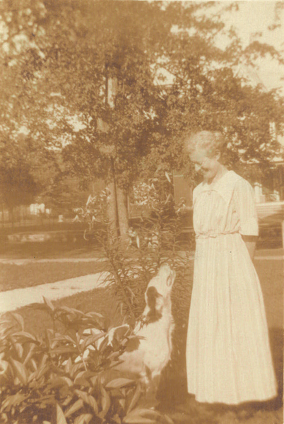 Belle Vivell and family hound dog. Photograph marked August 1917 on back